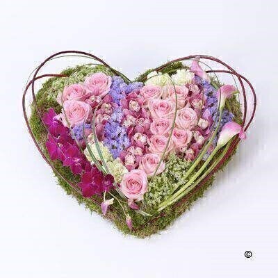 <h2>Orchid and Rose Contemporary Heart-Shaped Design | Funeral Flowers</h2>
<ul>
<li>Approximate Size W 50cm H 50cm</li>
<li>Hand created contemporary heart in fresh flowers</li>
<li>To give you the best we may occasionally need to make substitutes</li>
<li>Funeral Flowers will be delivered at least 2 hours before the funeral</li>
<li>For delivery area coverage see below</li>
</ul>
<br>
<h2><br />Liverpool Flower Delivery</h2>
<p>We have a wide selection of Funeral Hearts offered for Liverpool Flower Delivery. Funeral Hearts can be provided for you in Liverpool, Merseyside and we can organize Funeral flower deliveries for you nationwide. Funeral Flowers can be delivered to the Funeral directors or a house address. They can not be delivered to the crematorium or the church.</p>
<br>
<h2>Flower Delivery Coverage</h2>
<p>Our shop delivers funeral flowers to the following Liverpool postcodes L1 L2 L3 L4 L5 L6 L7 L8 L11 L12 L13 L14 L15 L16 L17 L18 L19 L24 L25 L26 L27 L36 L70 If your order is for an area outside of these we can organise delivery for you through our network of florists. We will ask them to make as close as possible to the image but because of the difference in stock and sundry items, it may not be exact.</p>
<br>
<h2>Liverpool Funeral Flowers | Hearts</h2>
<p>This beautiful heart-shaped design including large-headed roses, carnations, cymbidium orchids and dendrobium orchids gives a contemporary feel with sweeping pink calla lily, cornus and steel grass.</p>
<br>
<p>When a heart is sent as a funeral tribute it is symbolic of comfort in ones last resting place. It makes deeply personal statement that is indicative of the love and compassion felt by immediate family or closely bereaved.</p>
<br>
<p>Contents of the product:23 inch heart frame, 12 pink roses, 3 cerise alstroemeria, 3 pink calla lily, 4 green carnations, 1 pink mini cymbidium orchid, 1 purple dendrobium orchid, 3 lilac statice, together with china grass, steel grass and red cornus.</p>
<br>
<h2>Best Florist in Liverpool</h2>
<p>Trust Award-winning Liverpool Florist, Booker Flowers and Gifts, to deliver funeral flowers fitting for the occasion delivered in Liverpool, Merseyside and beyond. Our funeral flowers are handcrafted by our team of professional fully qualified who not only lovingly hand make our designs but hand-deliver them, ensuring all our customers are delighted with their flowers. Booker Flowers and Gifts your local Liverpool Flower shop.</p>
<p><br /><br /></p>
<p><em>Jane Catherine and family - Review by post - Funeral Florist Liverpool</em></p>
<br>
<p><em>Thank you so much for the amazing flowers you arranged for our mum she would have loved them. Love Jane, Catherine and family</em></p>
